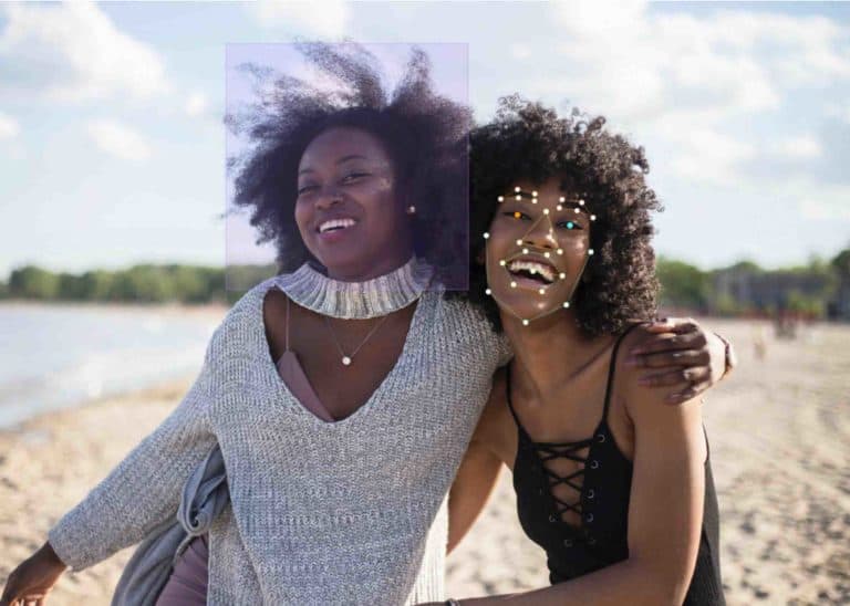 facial recognition of two black woman on a beach using machine learning