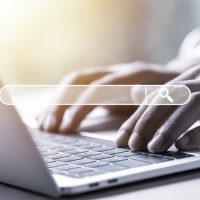 Searching browsing data information network concept. Businessman using laptop computer to input keyword for search and find knowledge.